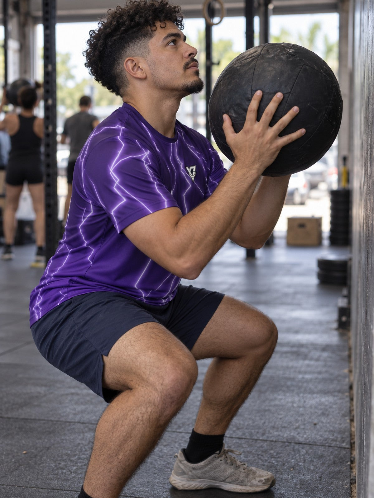 Man training in the Storm Bolt men's sports jersey with the Vantacore V emblem on the left chest – side view