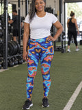 Woman wearing the Oil Slick high-waisted yoga leggings with the Vantacore V emblem on the hip – front view