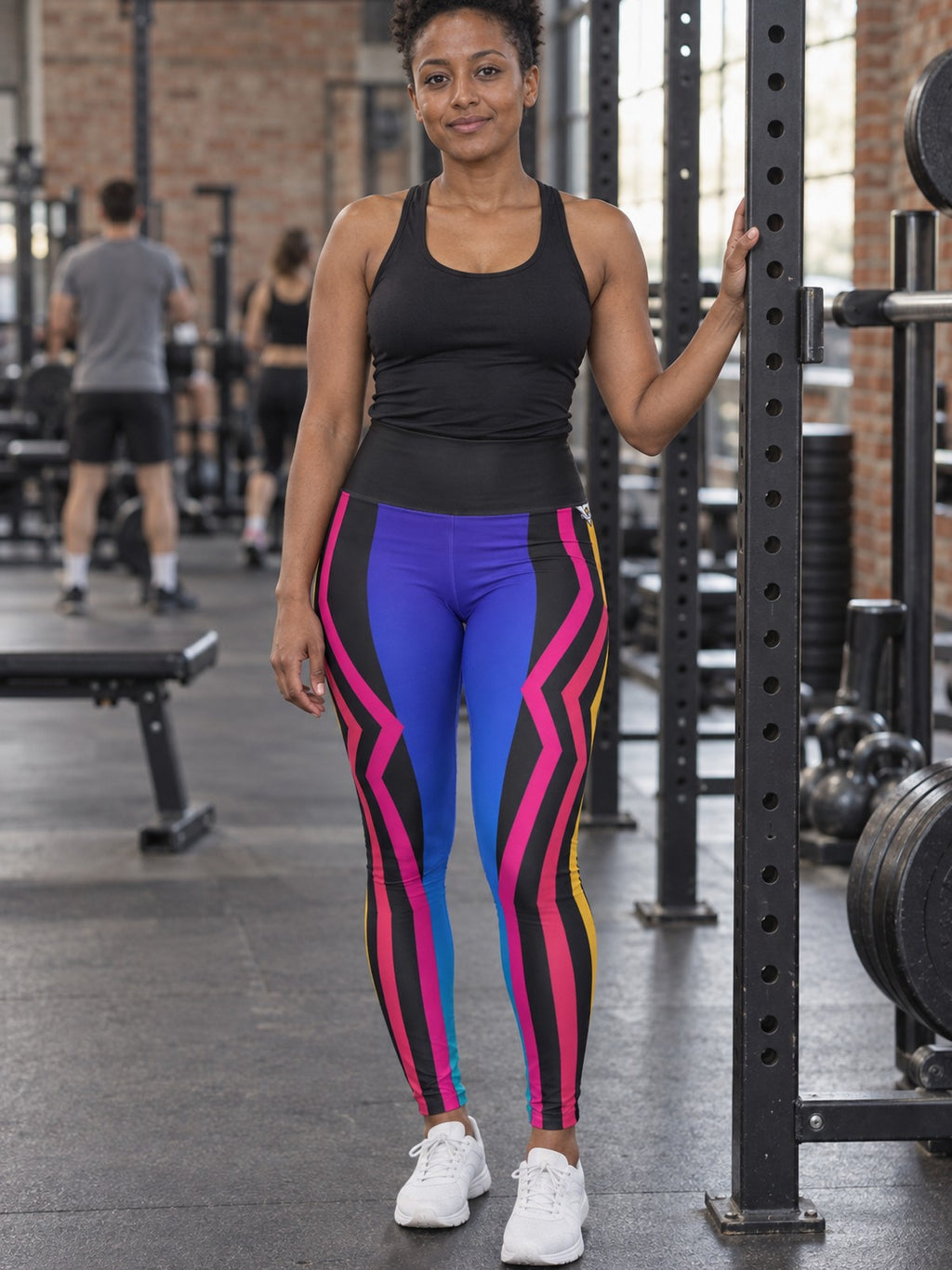 Woman wearing the Spectrum Rush High-Waisted Yoga Leggings with the Vantacore V emblem on the hip – front view