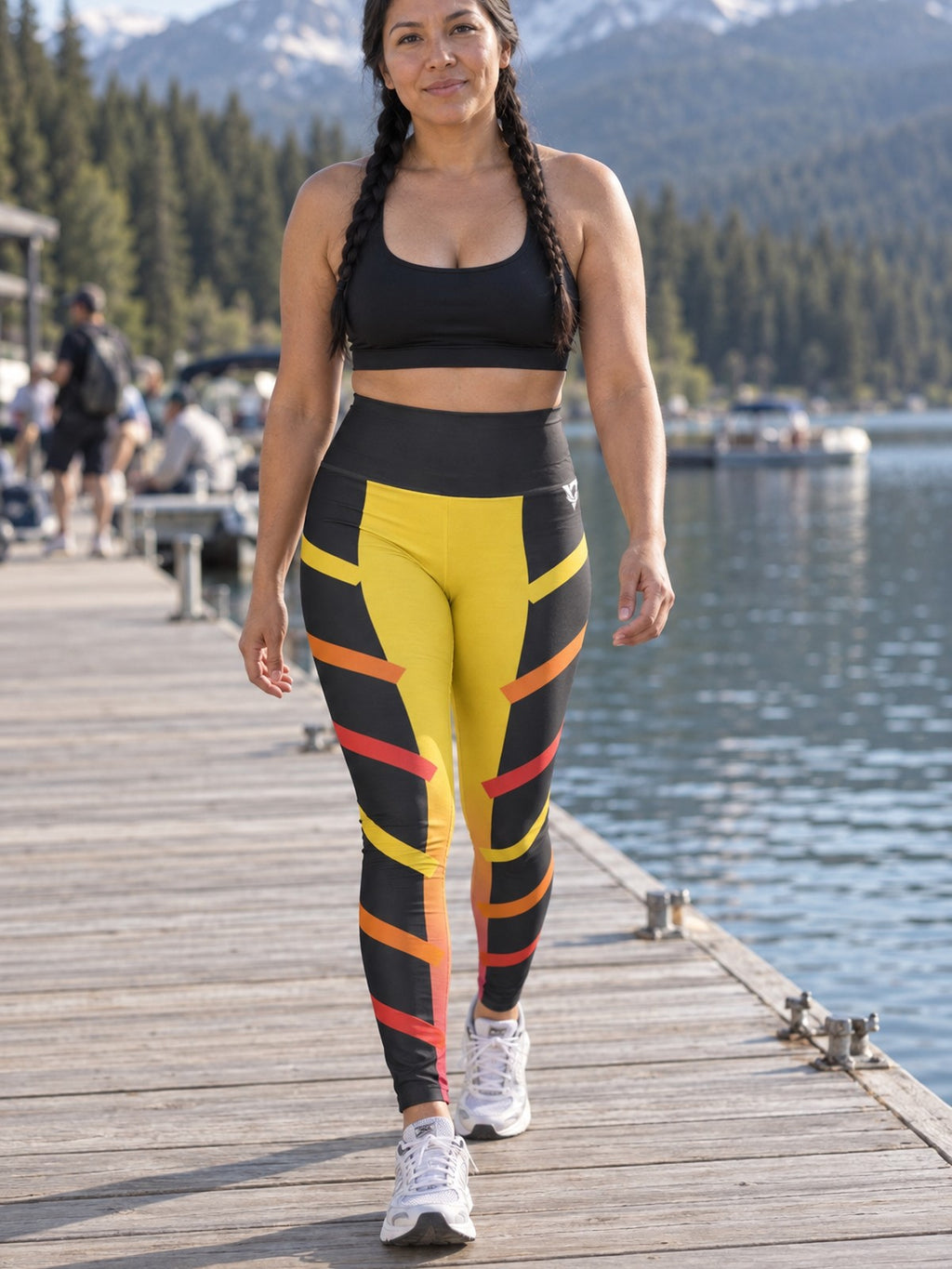Woman wearing the Solar Pulse High-Waisted Yoga Leggings with the Vantacore V emblem on the hip – front view