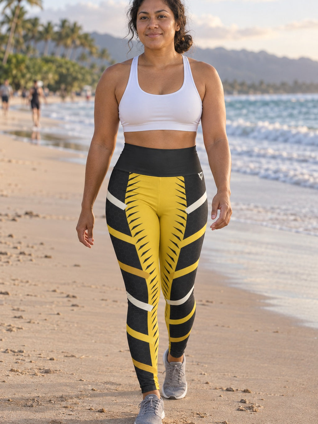 Woman wearing the Golden Apex High-Waisted Yoga Leggings with the Vantacore V emblem on the hip – front view