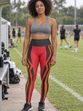 Woman wearing the Crimson Ember High-Waisted Yoga Leggings with the Vantacore V emblem on the hip – front view