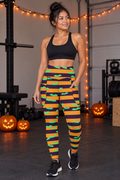 Halloween Hocus Pocus Bat Stripe leggings with pockets worn on a model