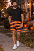 Men's Halloween Midnight Pumpkin Bat Stripe athletic multipurpose shorts worn on a model
