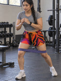 Women's Multipurpose Athletic Shorts with Pockets | Abstract Vibrant Geo – gym training, front view