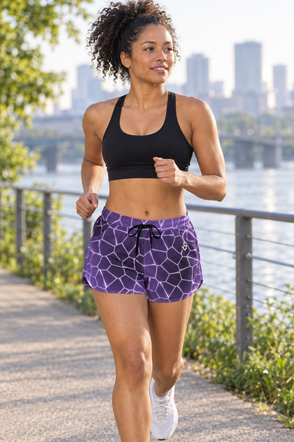 Woman jogging in Lilac Rift athletic shorts with pockets