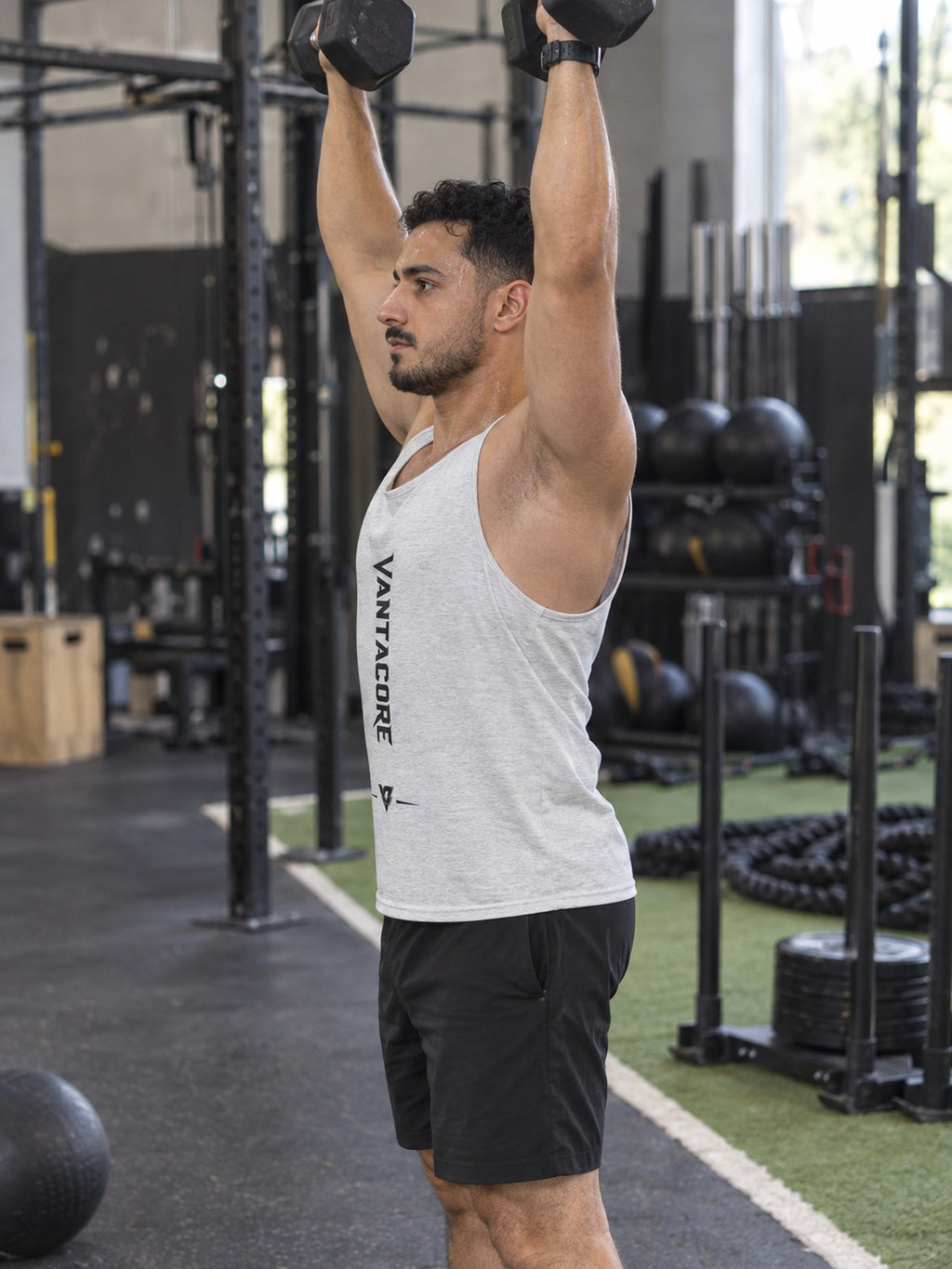 Vantacore Vertical Logo Tank Top – Minimalist Gym Tank | Unisex Sleeveless Fitness Shirt – gym training, side view