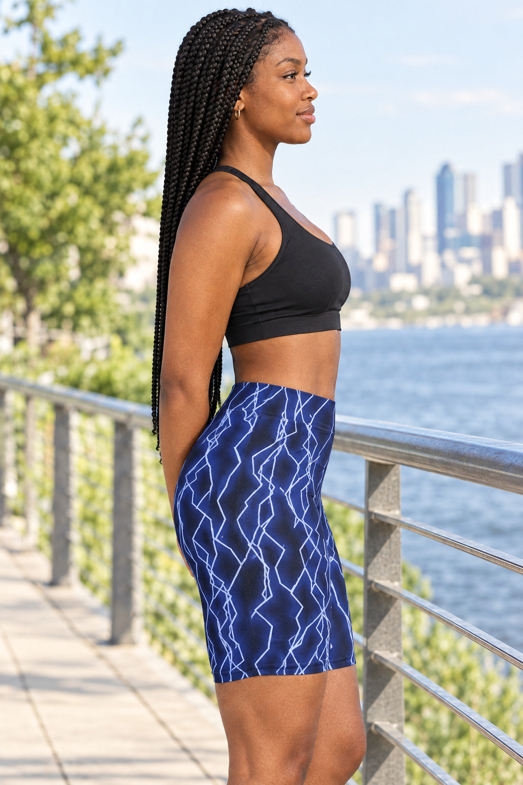 Midnight Lightning Women's Biker Shorts — High-Waist Workout Shorts, AI-generated side-profile product mockup on a fictional adult model