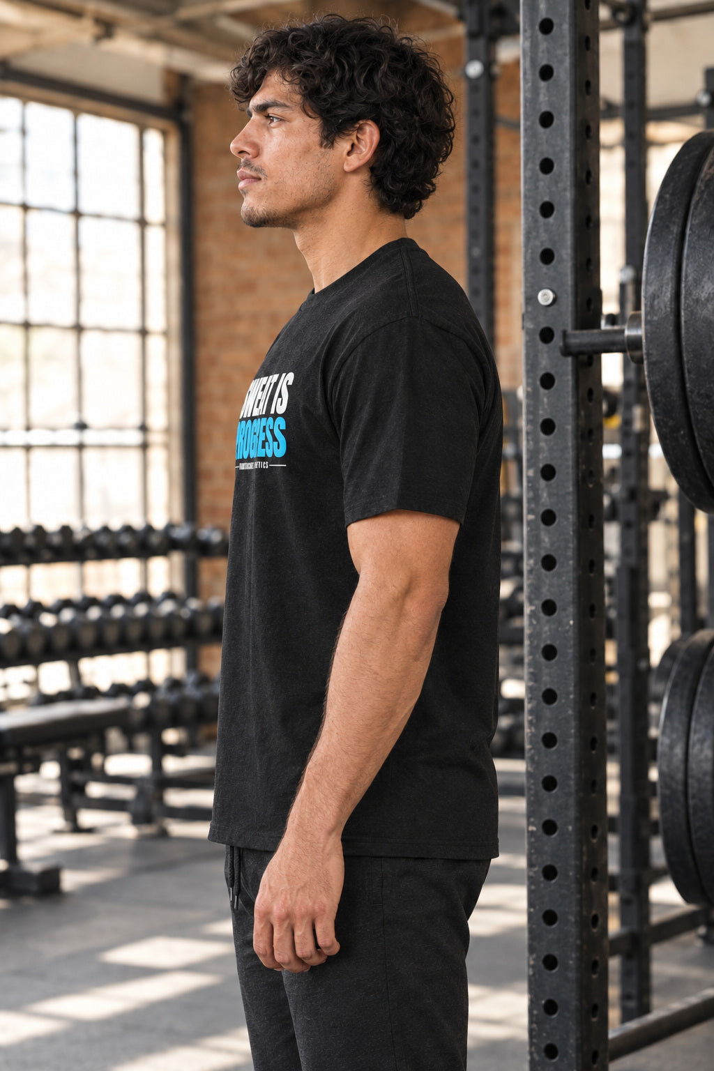 Sweat Is Progress | Men's Graphic Gym T-Shirt, AI-generated side-profile product mockup on a fictional adult model
