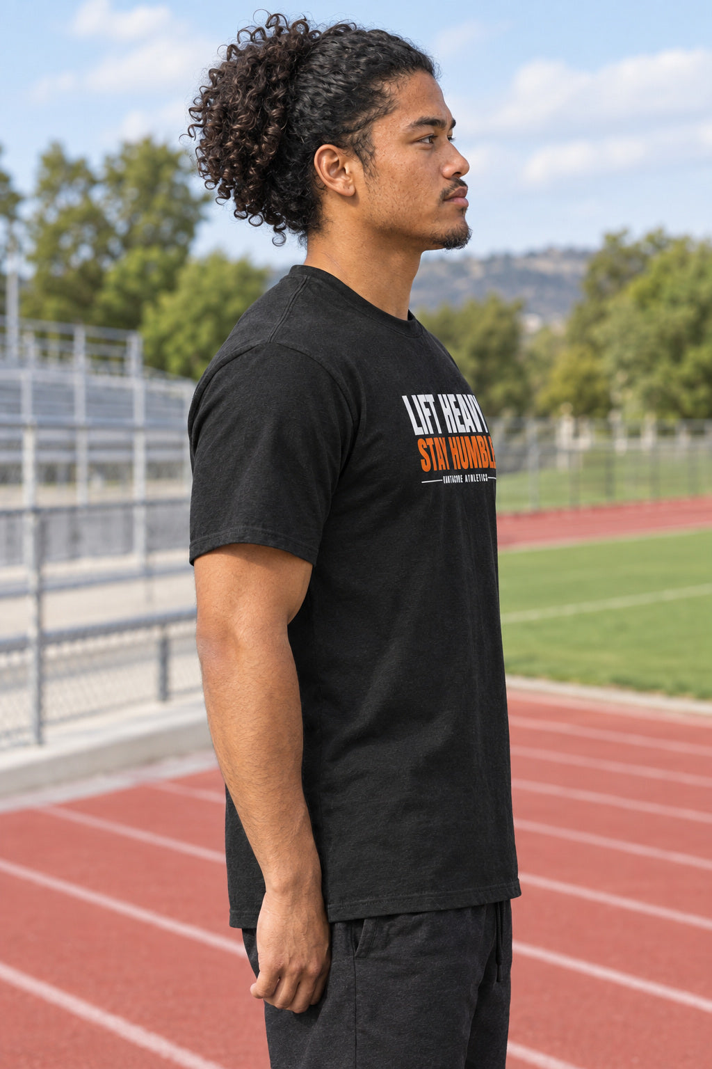 Lift Heavy Stay Humble | Men's Graphic Gym T-Shirt, AI-generated side-profile product mockup on a fictional adult model