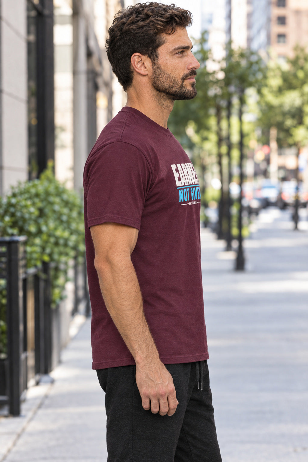Earned Not Given | Men's Graphic Gym T-Shirt, AI-generated side-profile product mockup on a fictional adult model