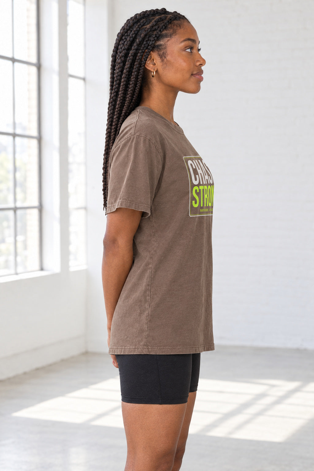 Chase Strong | Women's Garment-Dyed Graphic Tee, AI-generated side-profile product mockup on a fictional adult model