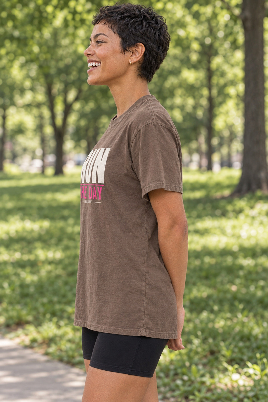 Run The Day | Women's Garment-Dyed Graphic Tee, AI-generated side-profile product mockup on a fictional adult model
