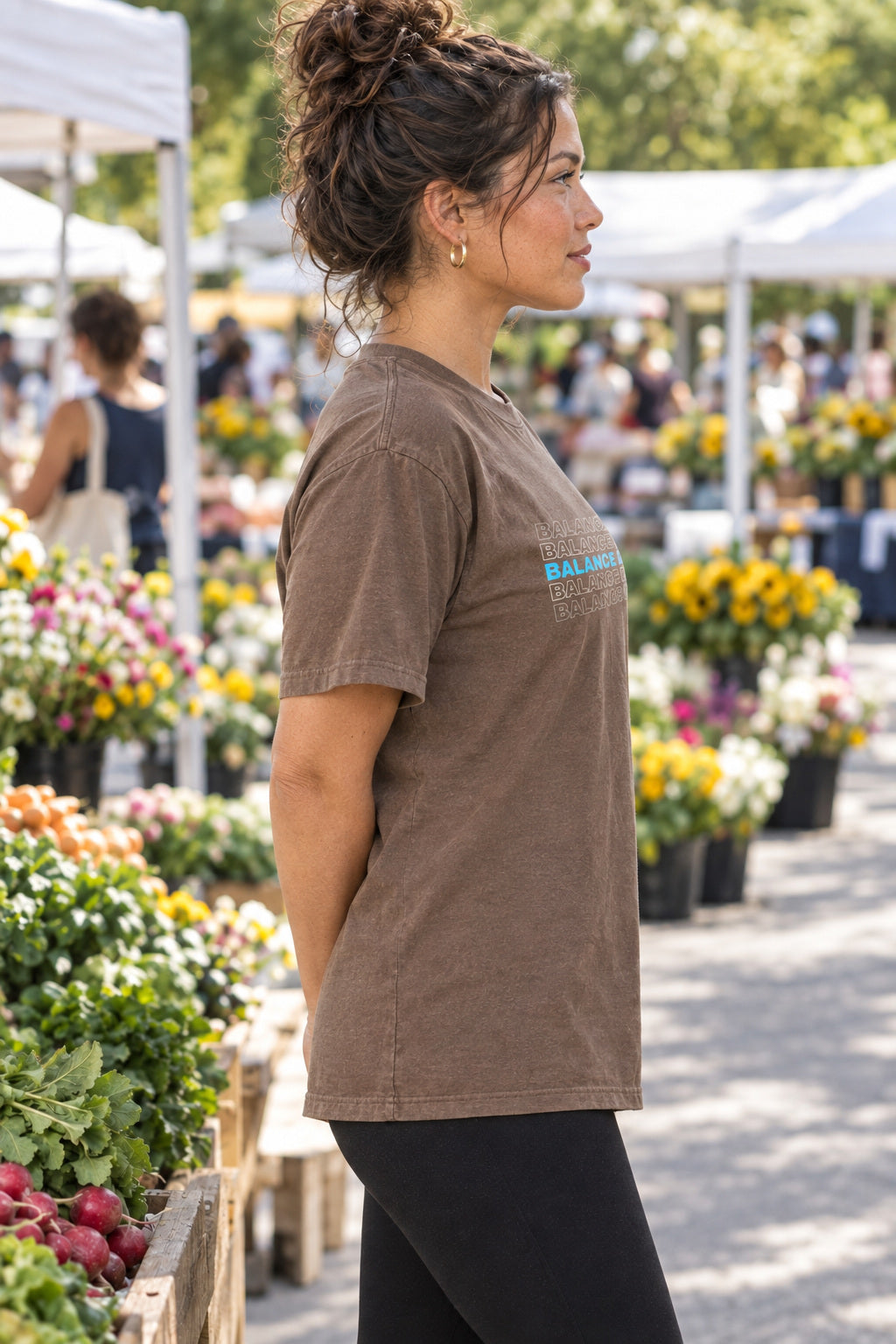 Balance And Burn | Women's Garment-Dyed Graphic Tee, AI-generated side-profile product mockup on a fictional adult model