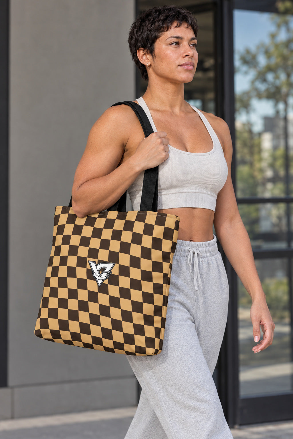 Desert Warp Check Tote Bag — All-Over Print Gym & Everyday Tote, AI-generated realistic three-quarter mockup on a fictional adult model