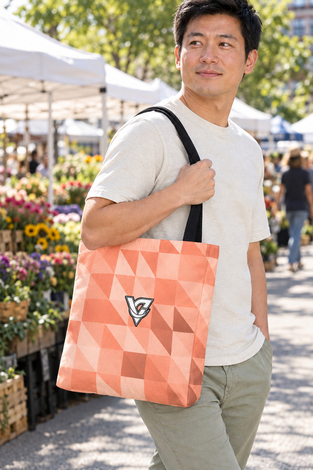 Peach Low-Poly Tote Bag — All-Over Print Gym & Everyday Tote, AI-generated realistic three-quarter mockup on a fictional adult model
