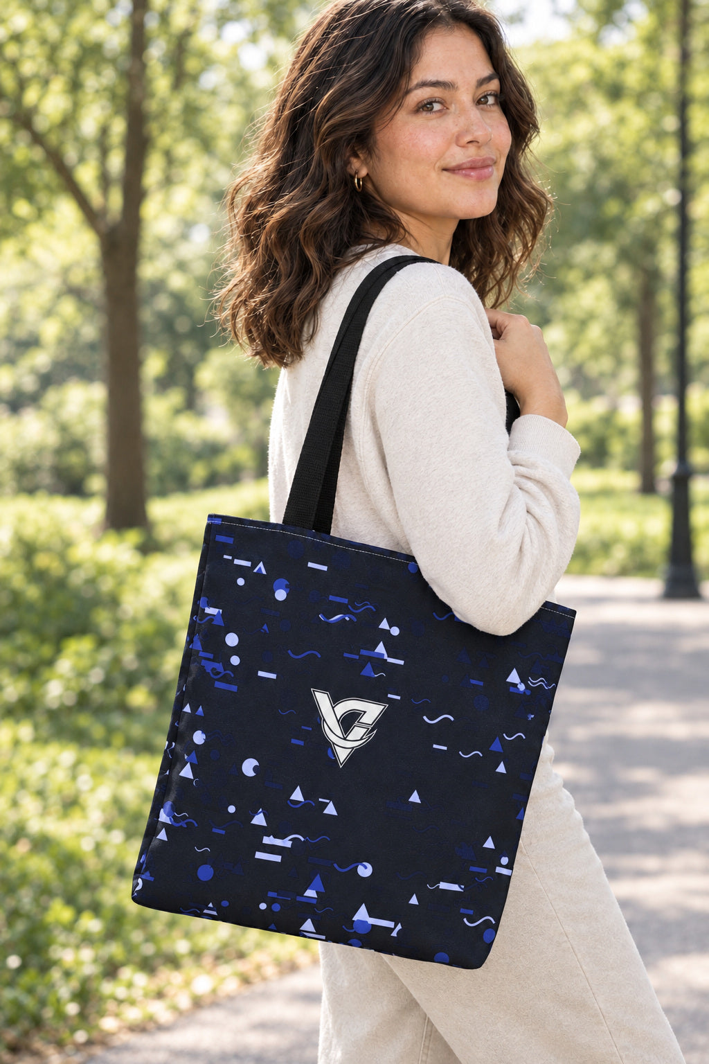 Midnight Confetti Tote Bag — All-Over Print Gym & Everyday Tote, AI-generated realistic three-quarter mockup on a fictional adult model