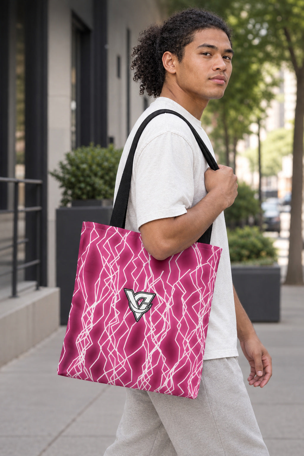 Hot Pink Lightning Tote Bag — All-Over Print Gym & Everyday Tote, AI-generated realistic three-quarter mockup on a fictional adult model