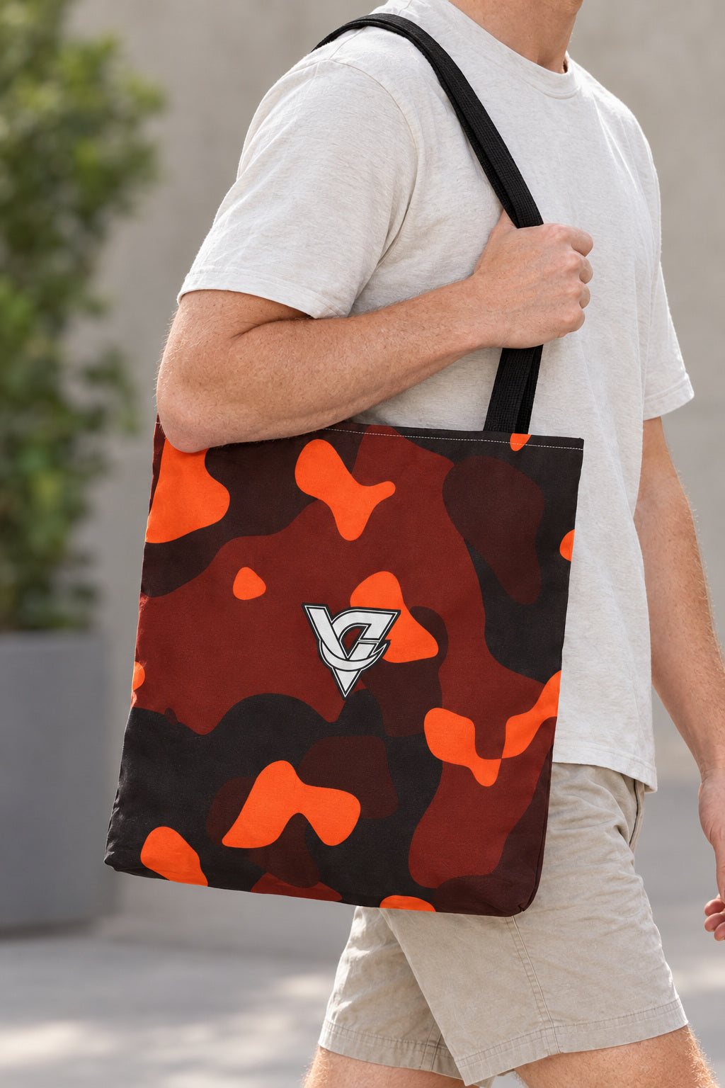 Ember Camo Tote Bag — All-Over Print Gym & Everyday Tote, AI-generated realistic detail mockup on a fictional adult model