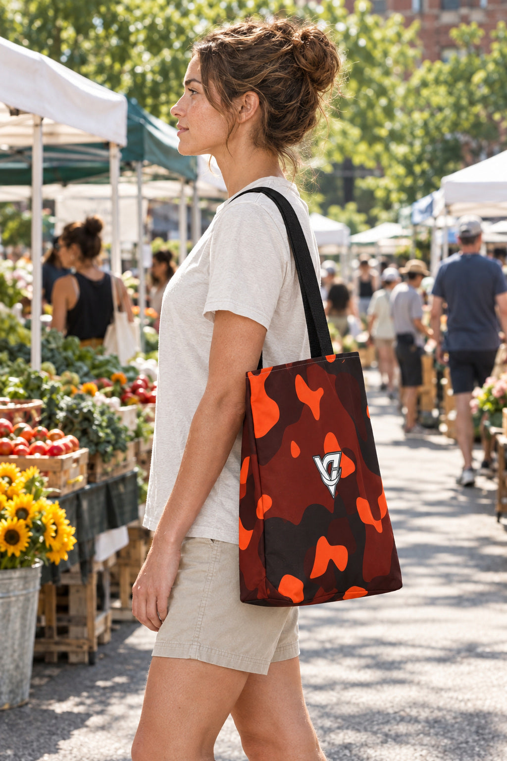 Ember Camo Tote Bag — All-Over Print Gym & Everyday Tote, AI-generated side-profile product mockup on a fictional adult model