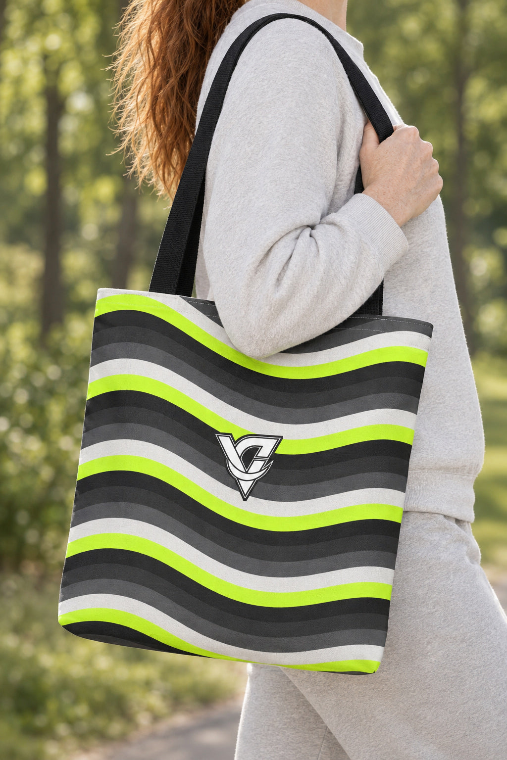 Graphite Wave Tote Bag — All-Over Print Gym & Everyday Tote, AI-generated realistic detail mockup on a fictional adult model