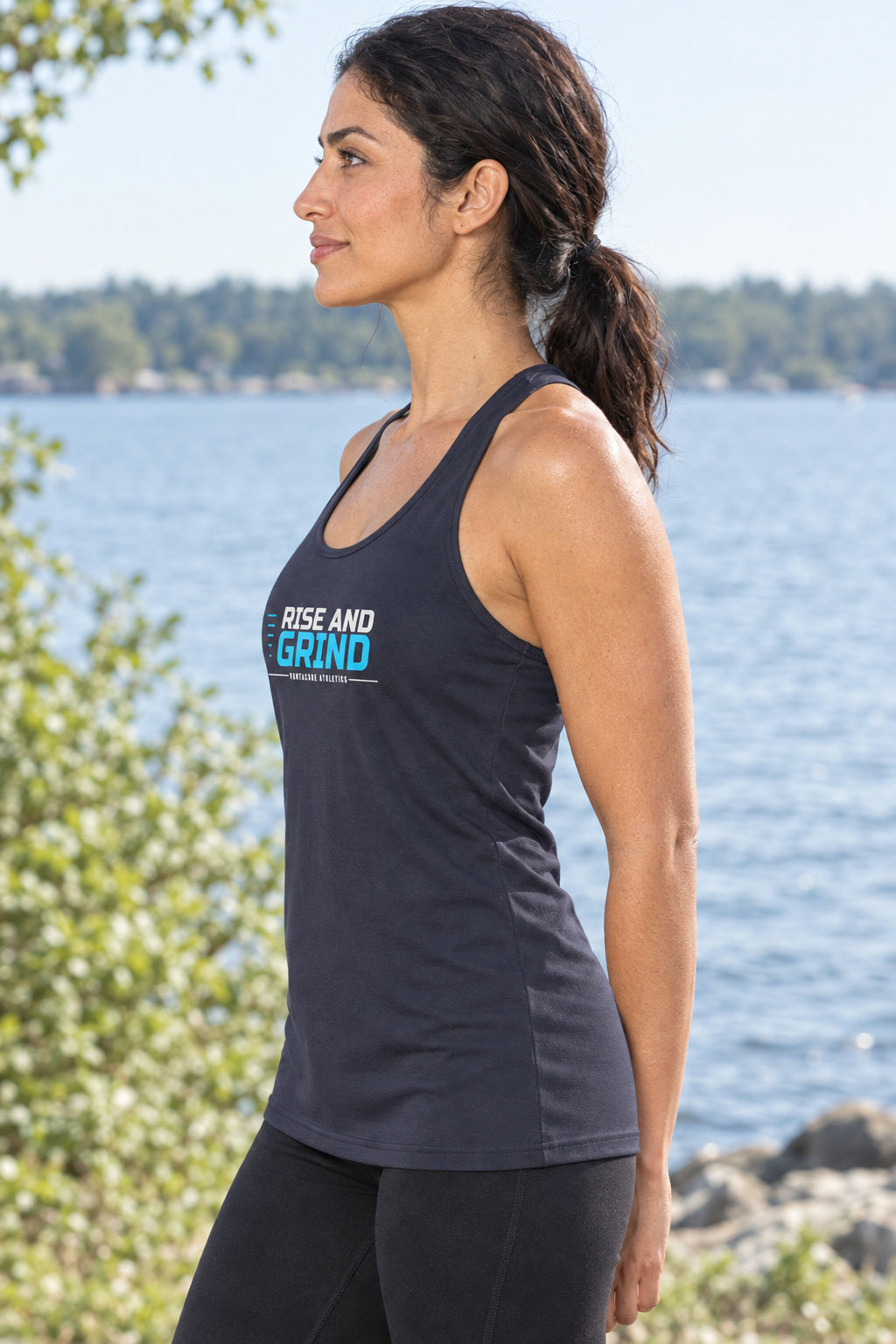 Rise And Grind | Women's Performance Racerback Tank, AI-generated side-profile product mockup on a fictional adult model