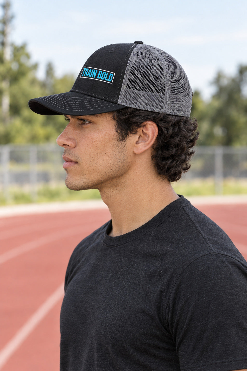 Train Bold Trucker Cap — Vantacore Snapback Hat, AI-generated side-profile product mockup on a fictional adult model