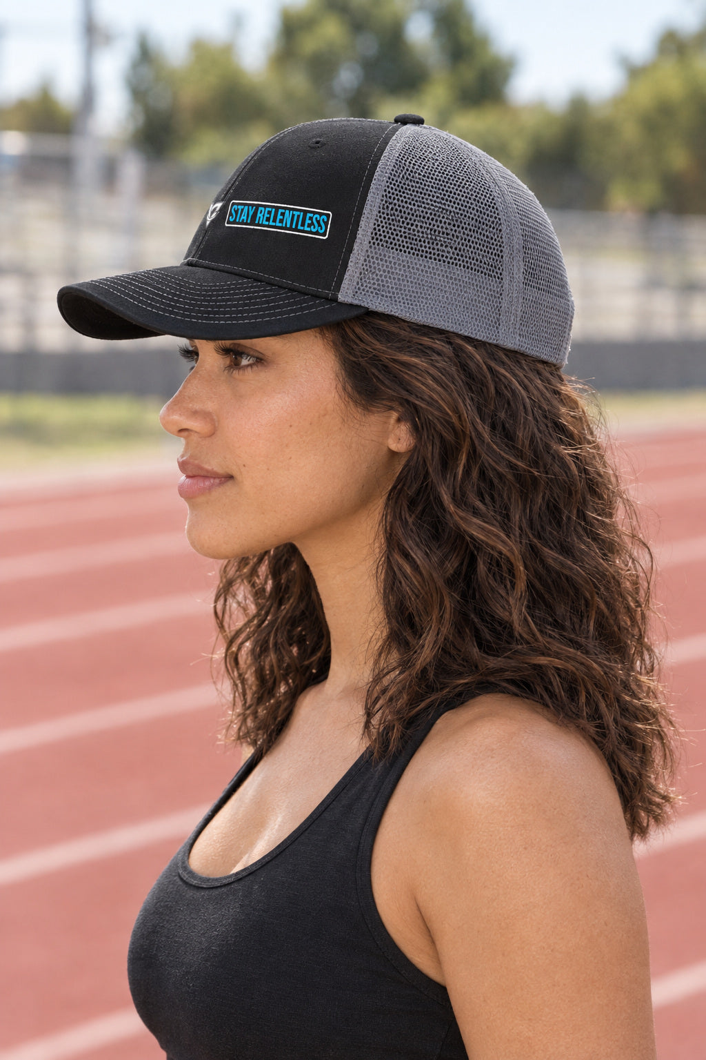 Stay Relentless Trucker Cap — Vantacore Snapback Hat, AI-generated side-profile product mockup on a fictional adult model