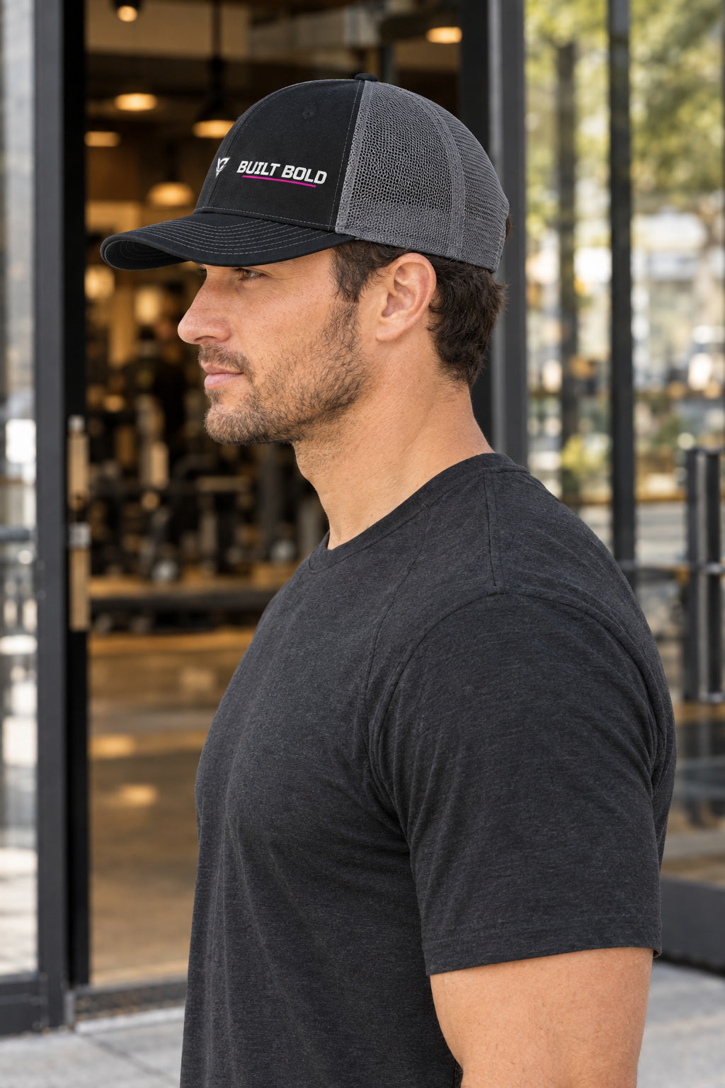 Built Bold Trucker Cap — Vantacore Snapback Hat, AI-generated side-profile product mockup on a fictional adult model