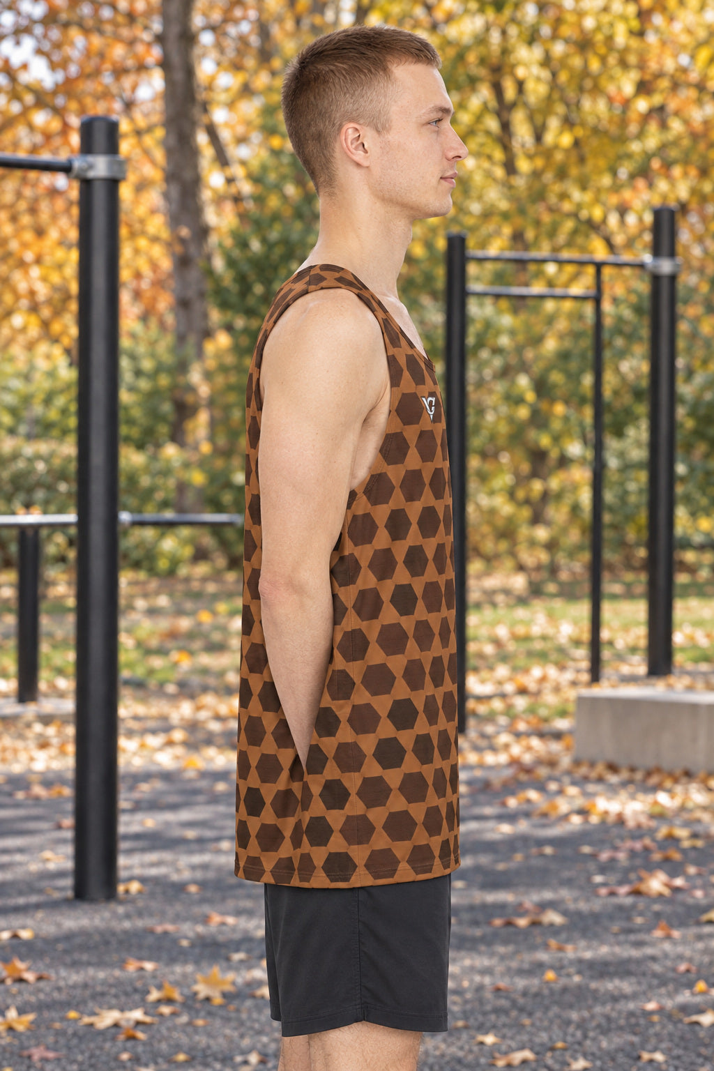 Chestnut Hex Grid Men's Athletic Tank, AI-generated side-profile product mockup on a fictional adult model