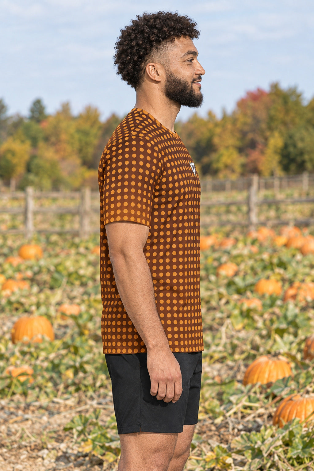 Cider Halftone Multipurpose Athletic Shirt, AI-generated side-profile product mockup on a fictional adult model