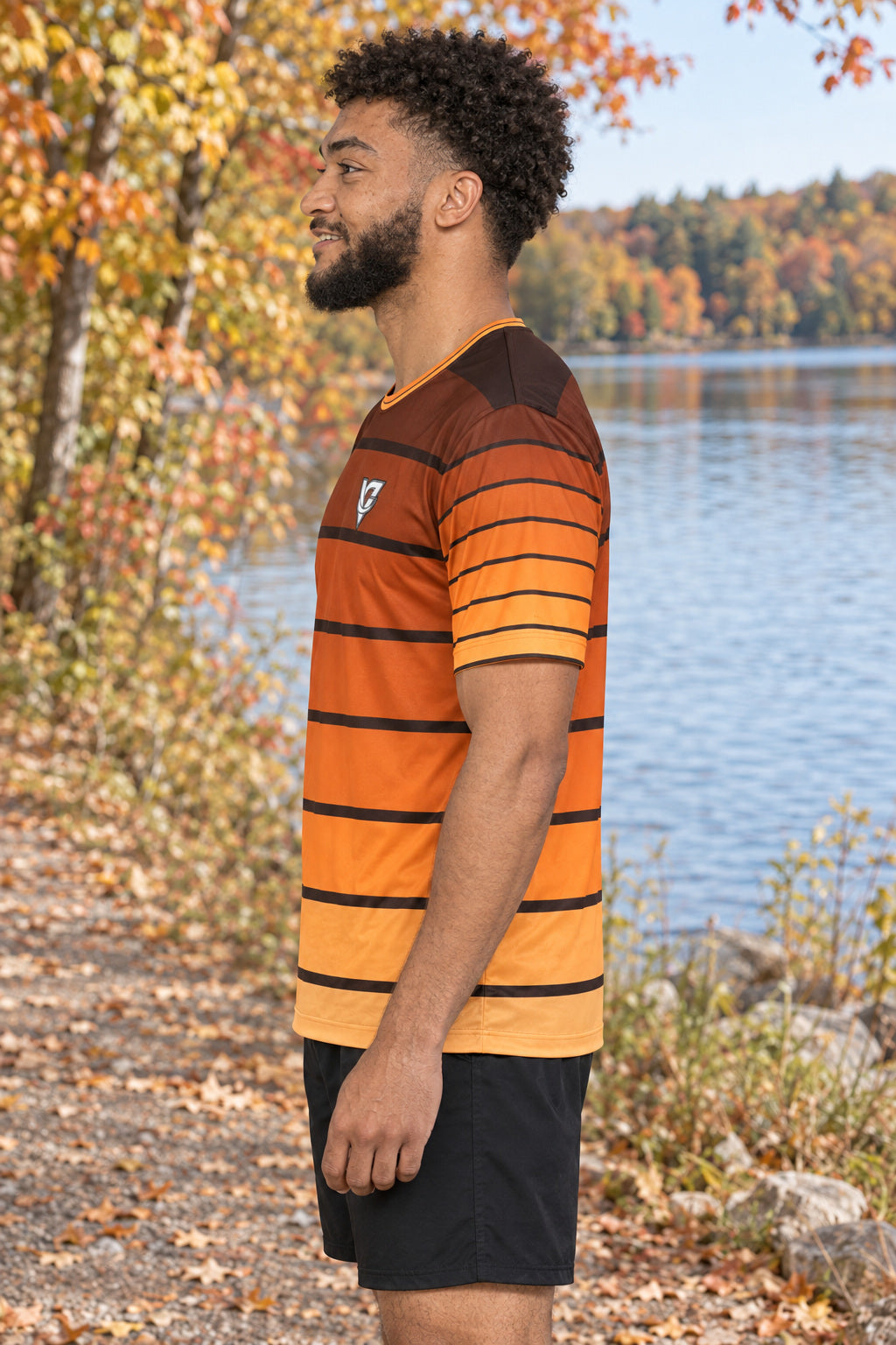 Pumpkin Horizon Multipurpose Athletic Shirt, AI-generated side-profile product mockup on a fictional adult model