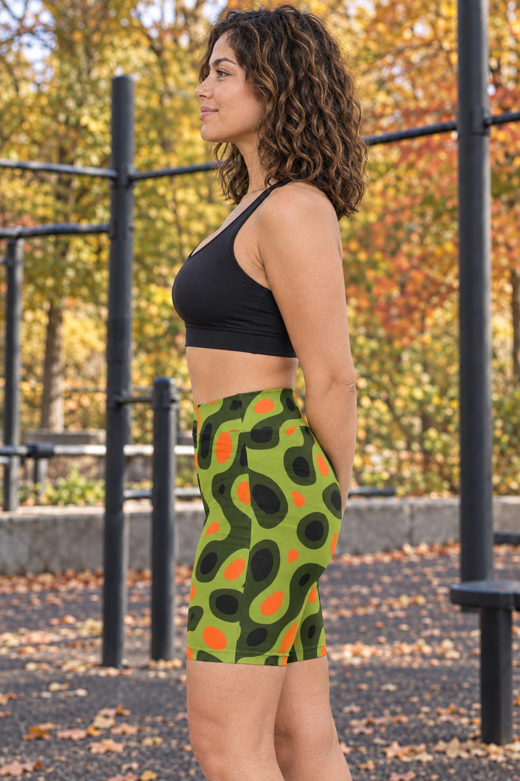 Moss Flame Ripple Women's Biker Shorts — High-Waist Workout Shorts, AI-generated side-profile product mockup on a fictional adult model