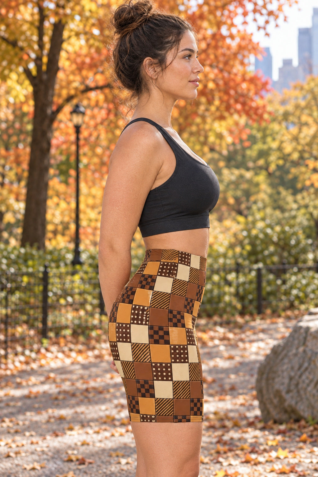 Cider Patchwork Women's Biker Shorts — High-Waist Workout Shorts, AI-generated side-profile product mockup on a fictional adult model