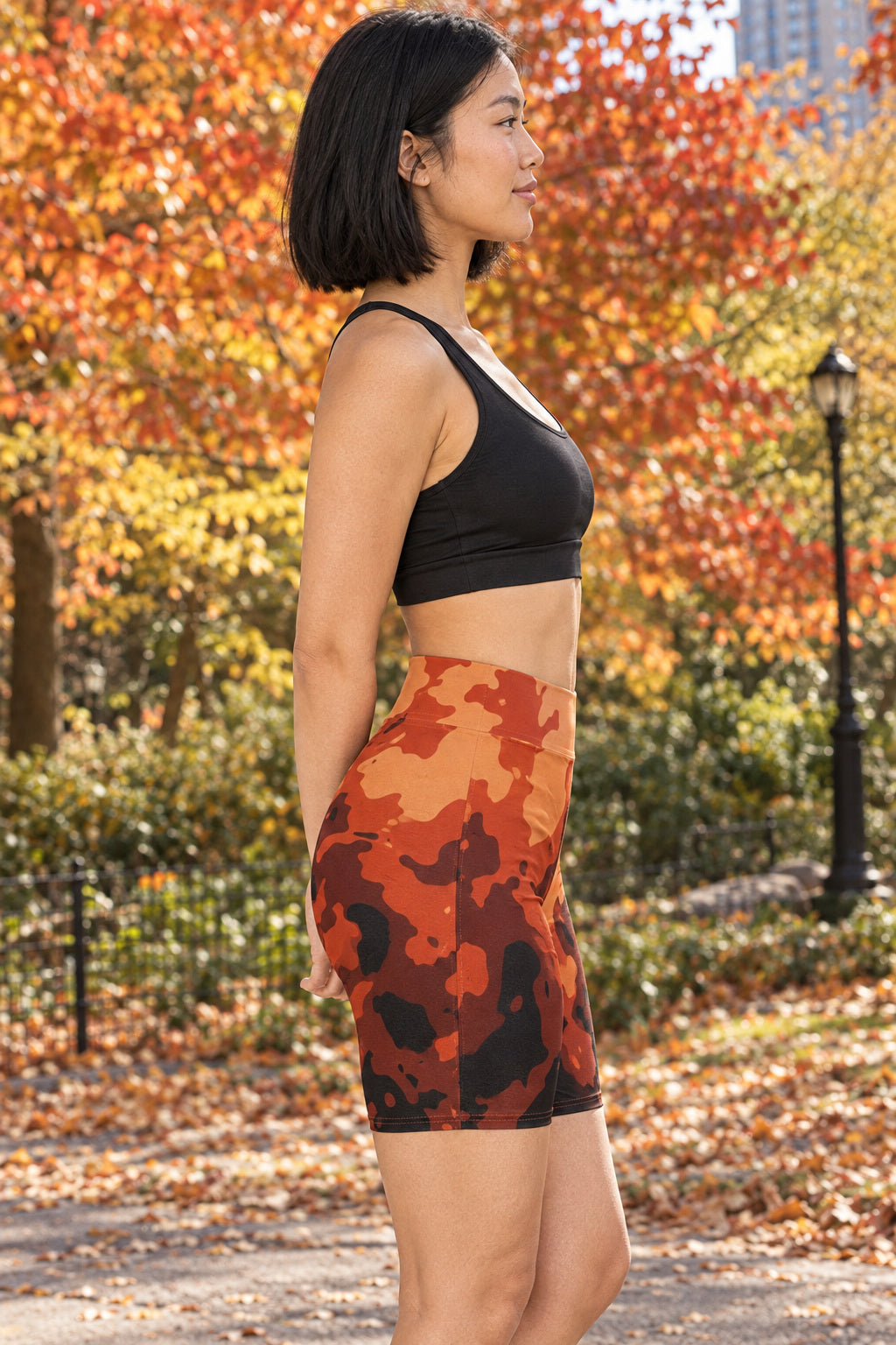 Rust Magma Women's Biker Shorts — High-Waist Workout Shorts, AI-generated side-profile product mockup on a fictional adult model