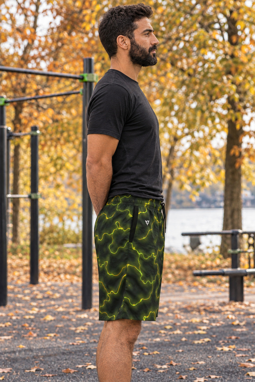 Men's Moss Flame Marble Performance Jogger Athletic Shorts with Pockets, AI-generated side-profile product mockup on a fictional adult model