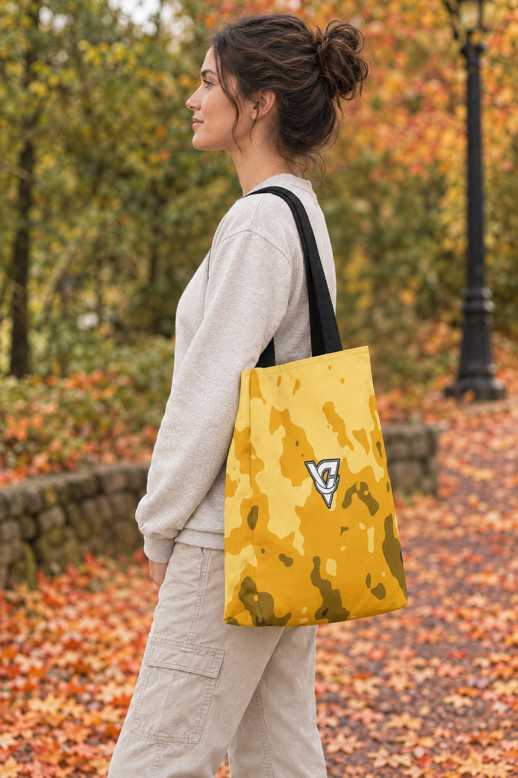 Mustard Magma Tote Bag — All-Over Print Gym & Everyday Tote, AI-generated side-profile product mockup on a fictional adult model