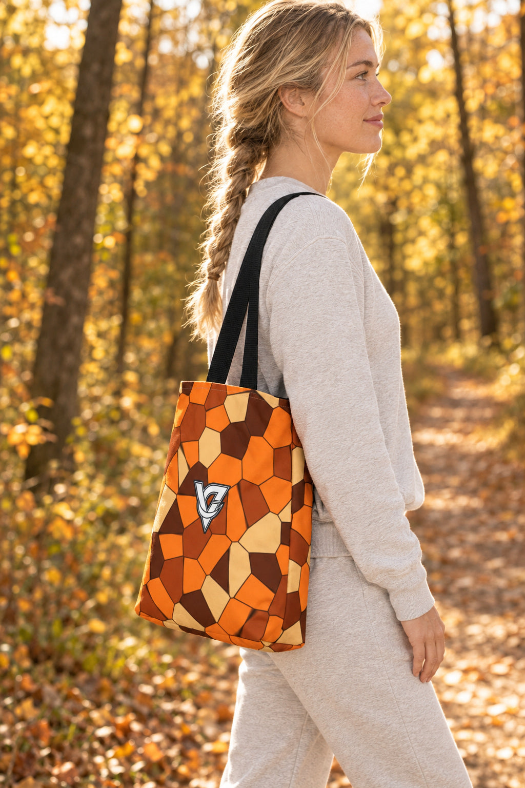 Pumpkin Mosaic Tote Bag — All-Over Print Gym & Everyday Tote, AI-generated side-profile product mockup on a fictional adult model