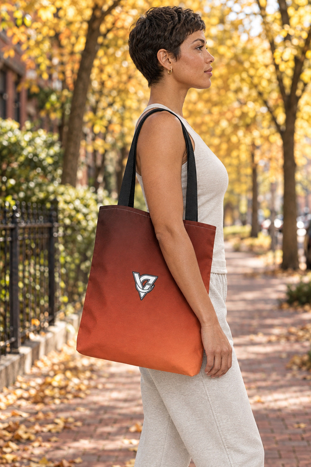 Terracotta Ombre Tote Bag — All-Over Print Gym & Everyday Tote, AI-generated side-profile product mockup on a fictional adult model