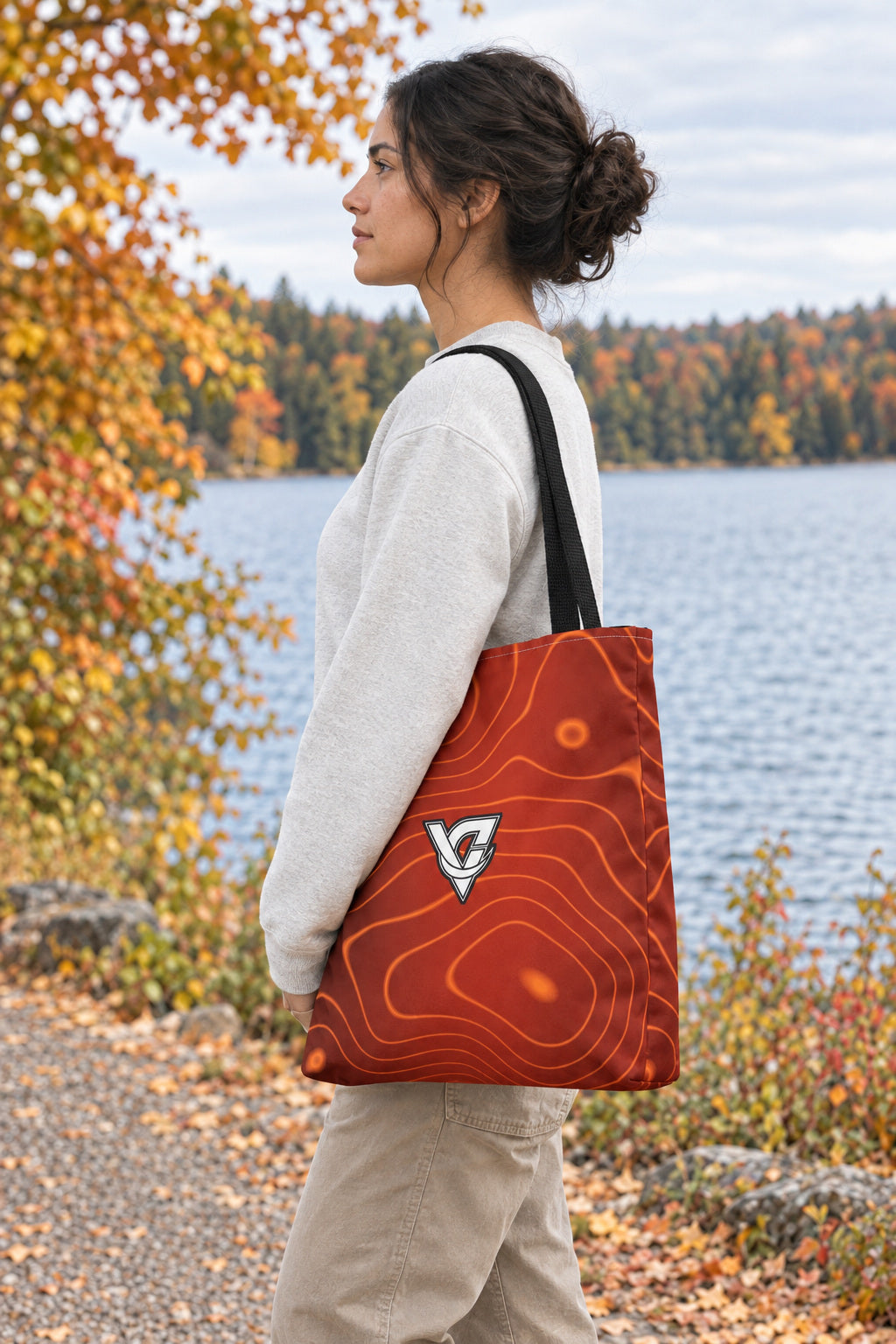 Sunset Orchard Topo Tote Bag — All-Over Print Gym & Everyday Tote, AI-generated side-profile product mockup on a fictional adult model