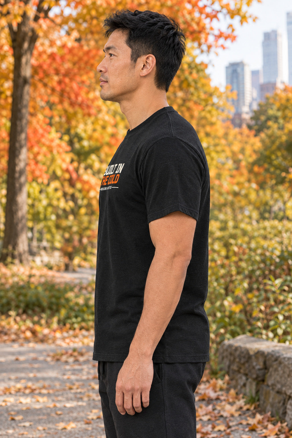 Built In The Cold | Men's Graphic Gym T-Shirt, AI-generated side-profile product mockup on a fictional adult model
