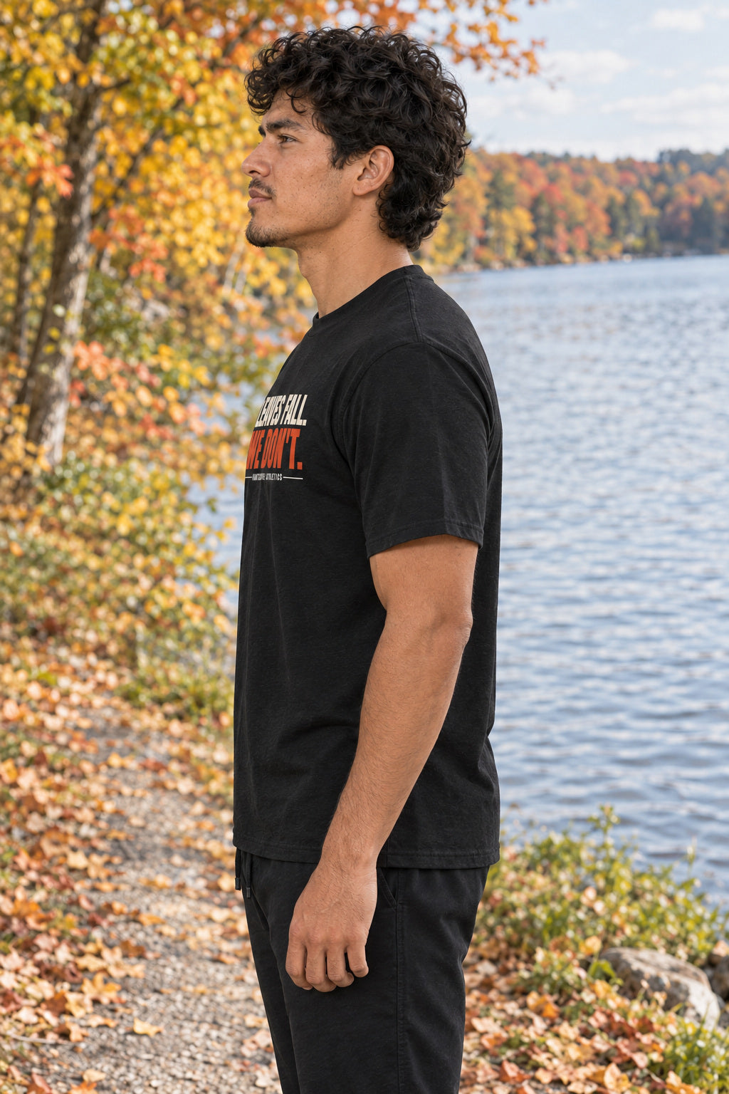 Leaves Fall. We Don'T. | Men's Graphic Gym T-Shirt, AI-generated side-profile product mockup on a fictional adult model