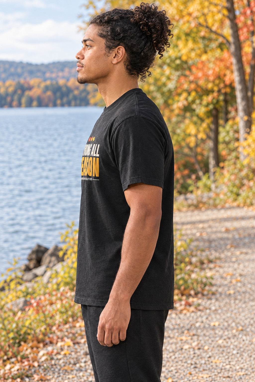 Strong All Season | Men's Graphic Gym T-Shirt, AI-generated side-profile product mockup on a fictional adult model