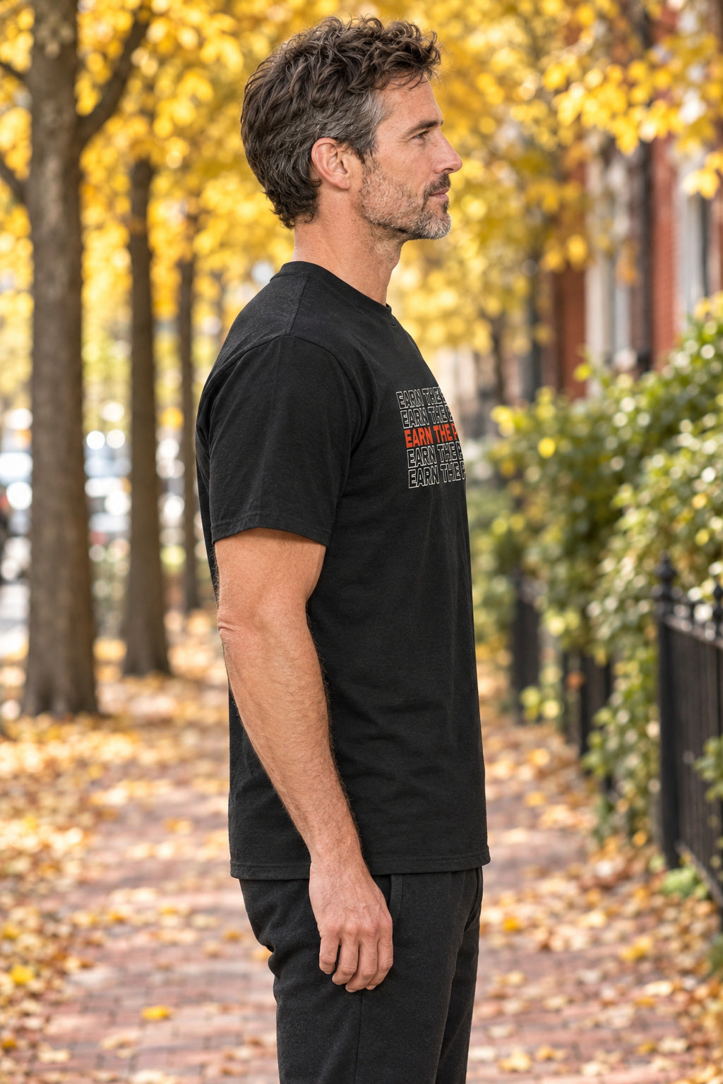 Earn The Pie | Men's Graphic Gym T-Shirt, AI-generated side-profile product mockup on a fictional adult model