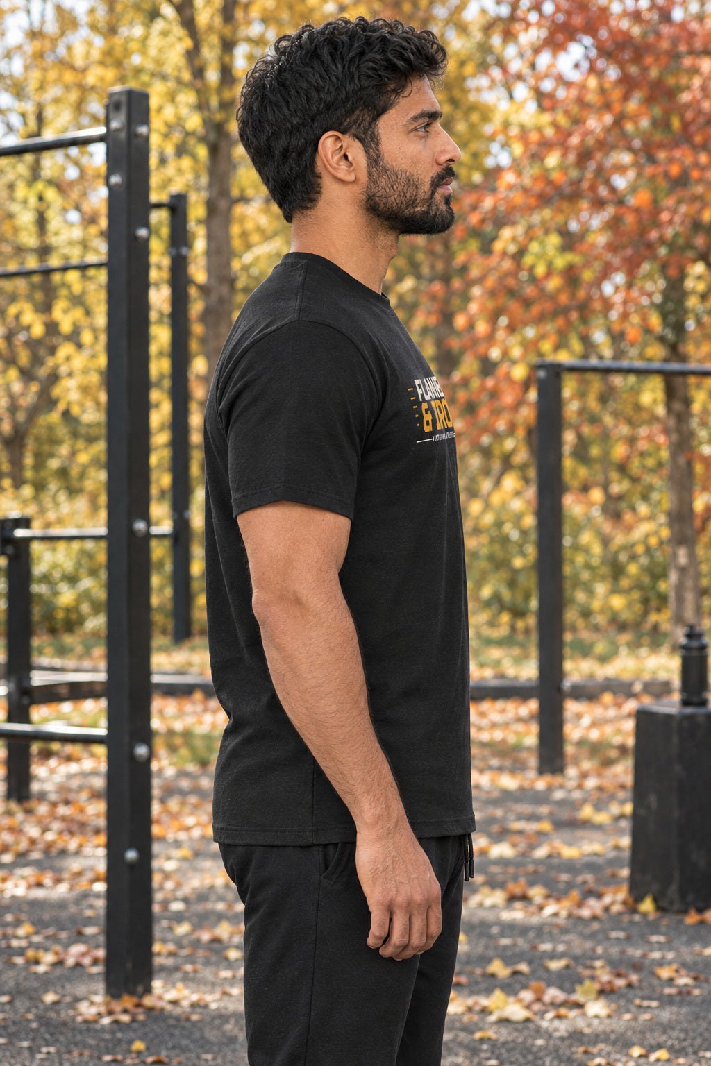 Flannel & Iron | Men's Graphic Gym T-Shirt, AI-generated side-profile product mockup on a fictional adult model