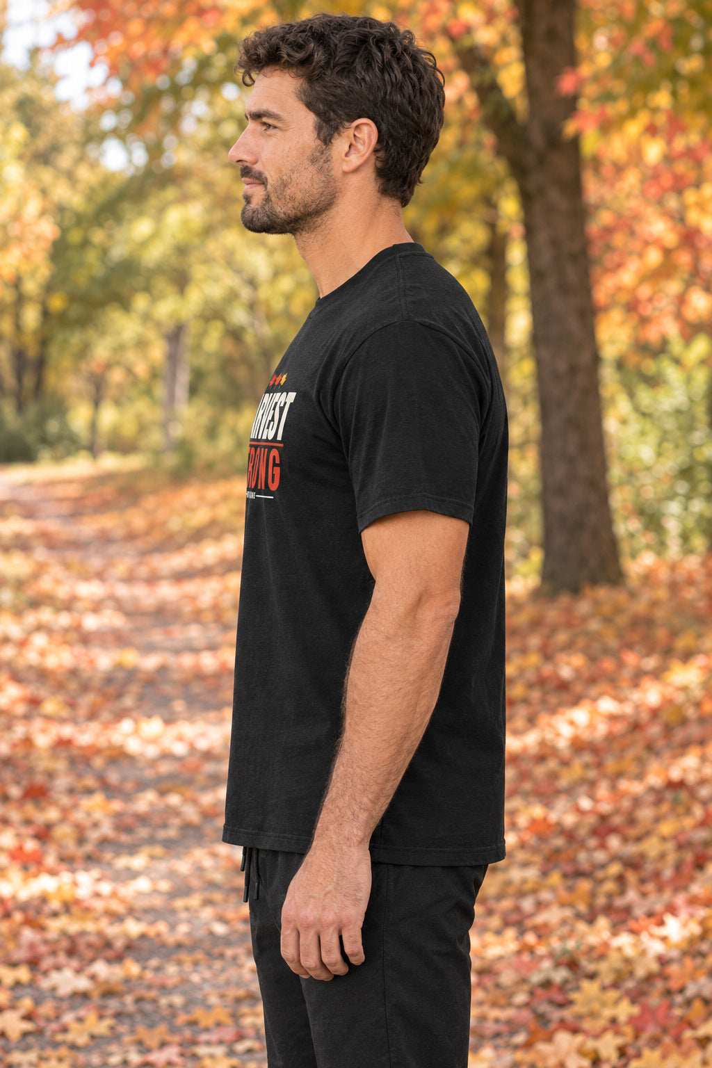 Harvest Strong | Men's Graphic Gym T-Shirt, AI-generated side-profile product mockup on a fictional adult model