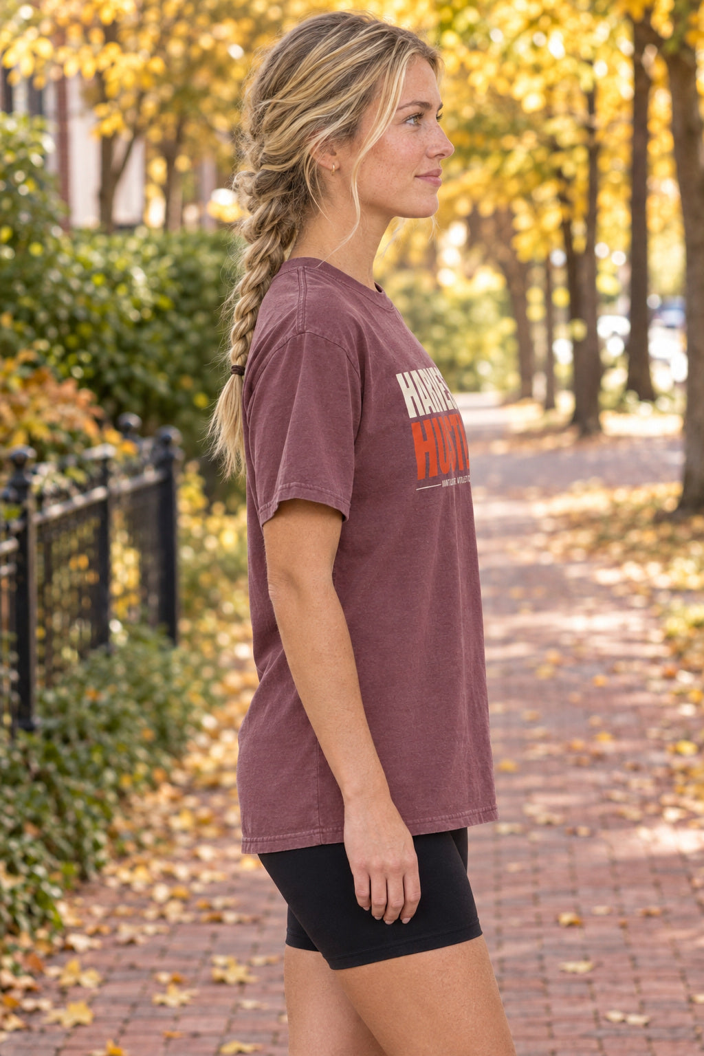 Harvest Hustle | Women's Garment-Dyed Graphic Tee, AI-generated side-profile product mockup on a fictional adult model