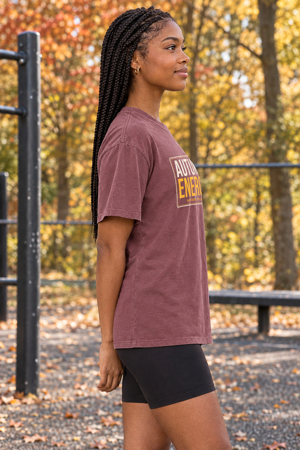 Autumn Energy | Women's Garment-Dyed Graphic Tee, AI-generated side-profile product mockup on a fictional adult model