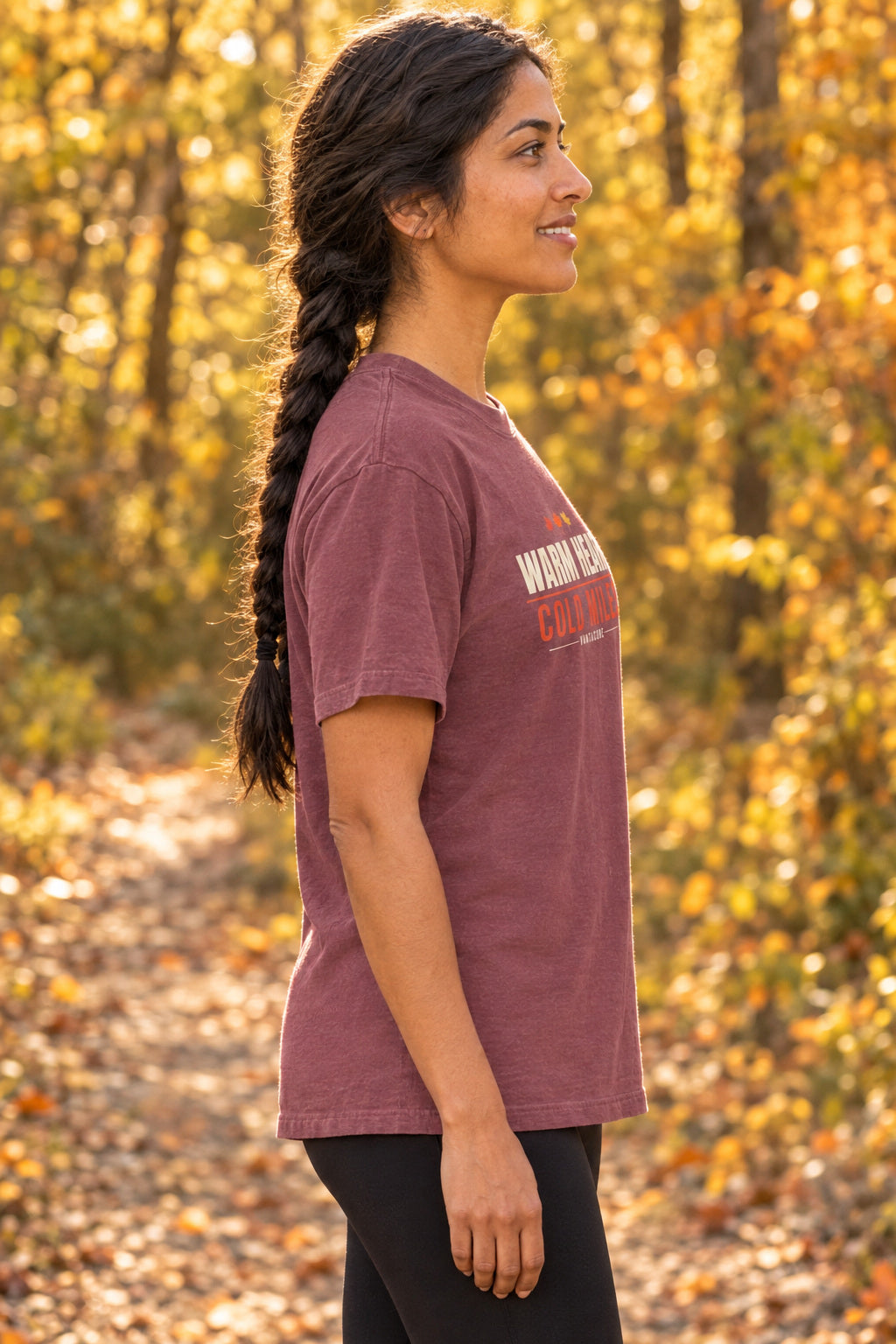 Warm Heart Cold Miles | Women's Garment-Dyed Graphic Tee, AI-generated side-profile product mockup on a fictional adult model
