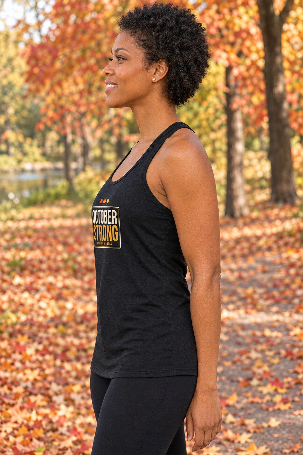 October Strong | Women's Performance Racerback Tank, AI-generated side-profile product mockup on a fictional adult model